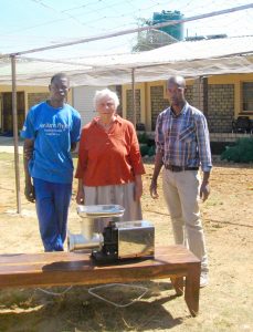 Mboma, S Virginia and Mr. Musonda with electric mincer