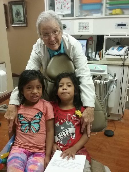 Sister Myra with girls in the Dental Van